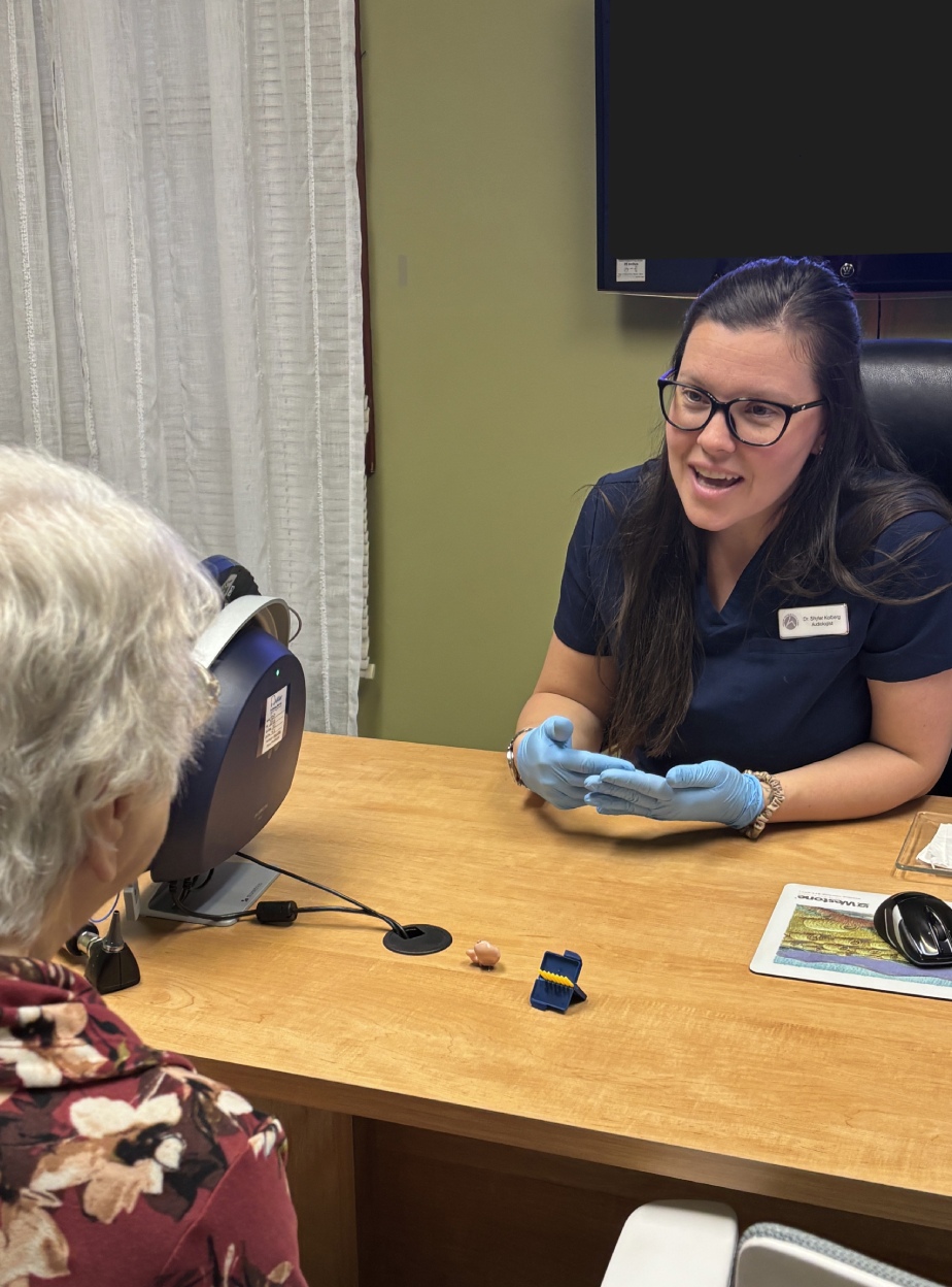Audiologist Shyler talking to patient